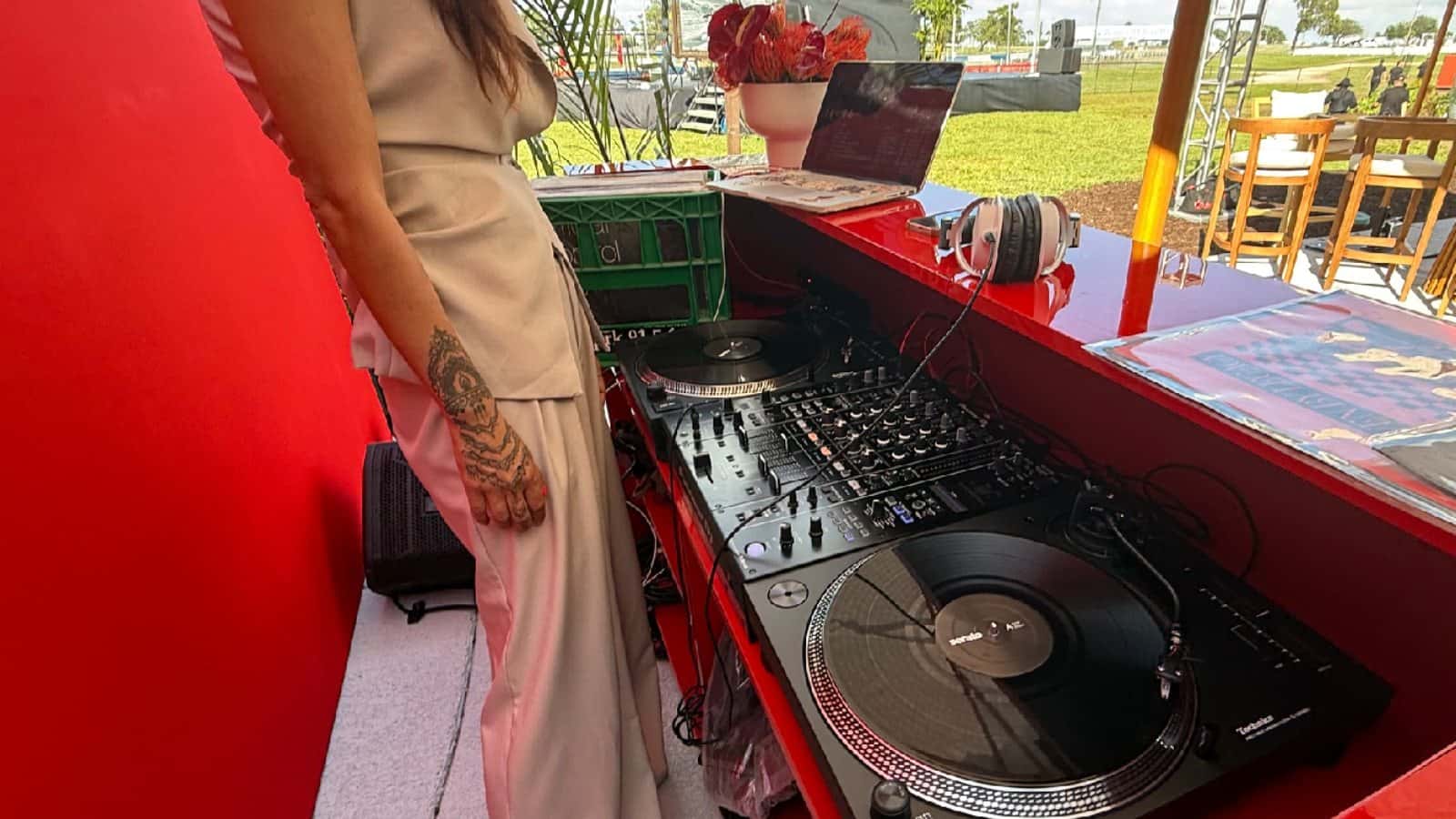 Turntables, mixer, and laptop arranged in a digital-vinyl DJ workflow
