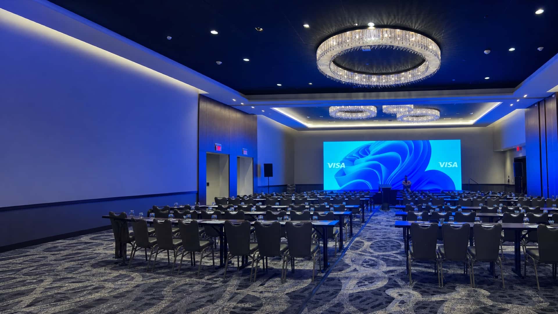 Conference ballroom in Orlando with a large LED video wall and classroom seating