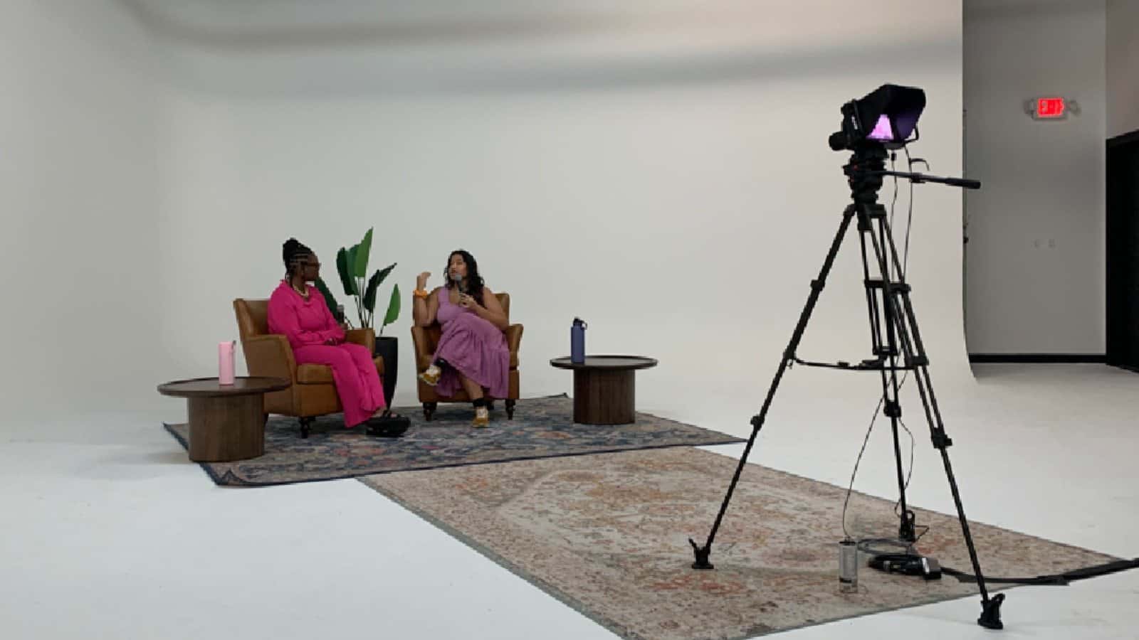 Studio camera on a tripod in an authentic podcast production setup