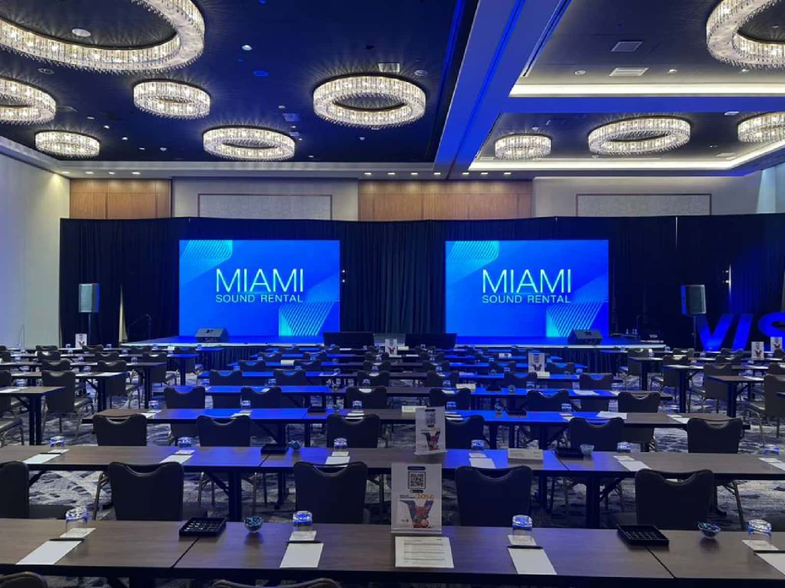 Visa Summit 2026 corporate conference room with dual presentation screens produced by Miami Sound Rental