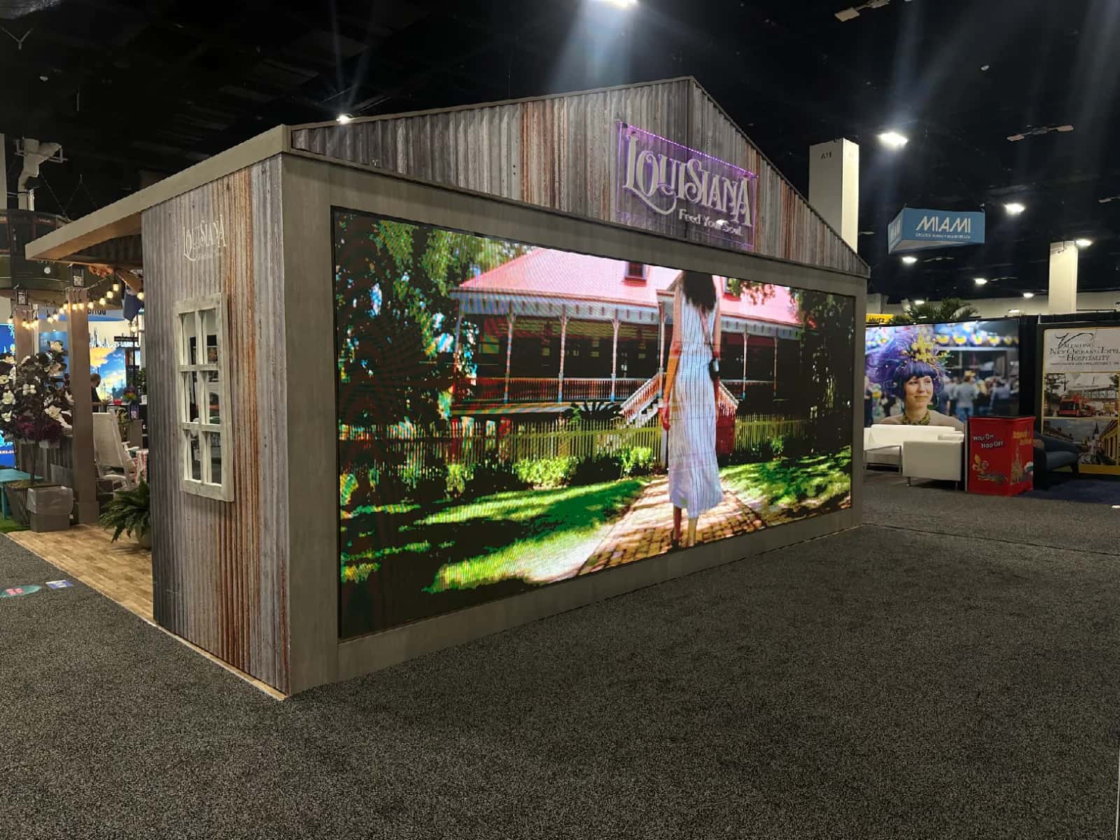Large LED video display integrated into a Louisiana tourism trade show booth