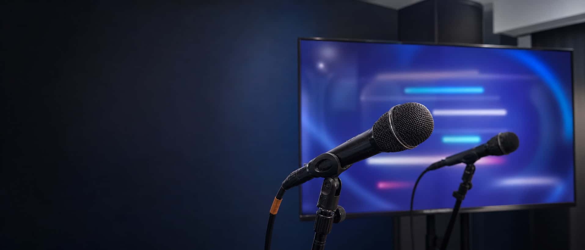 Professional karaoke rental setup with microphones, screen, and speaker in Miami