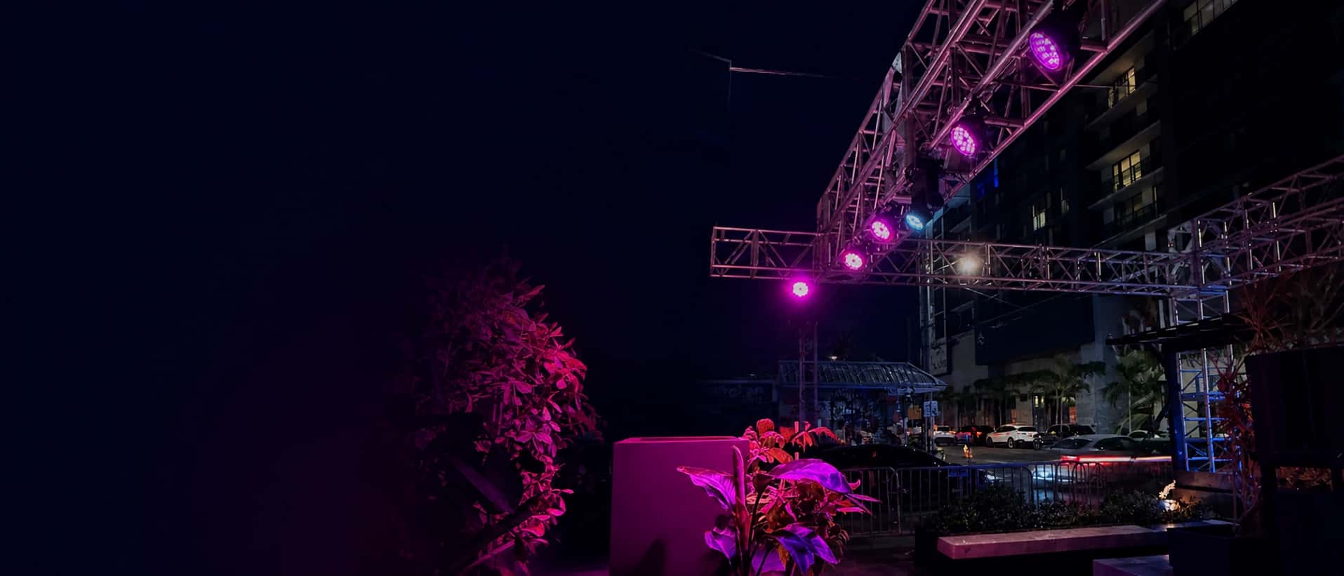 Professional event lighting fixtures mounted on an outdoor truss in Miami