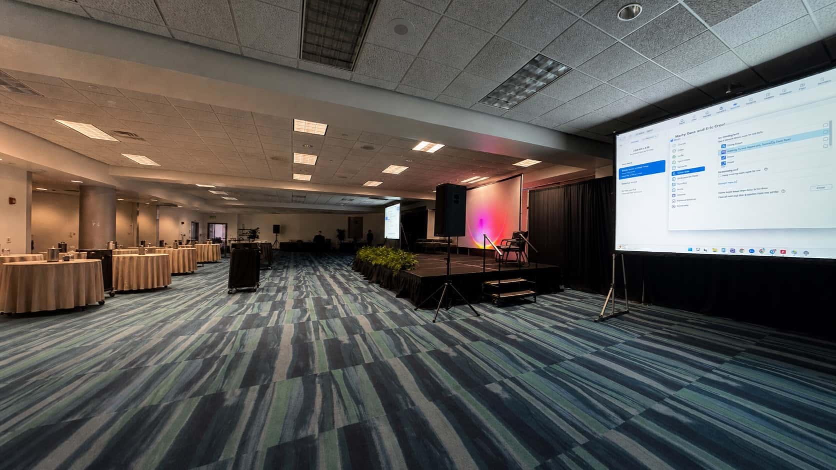 Large projector screen and presentation stage in an Orlando conference room