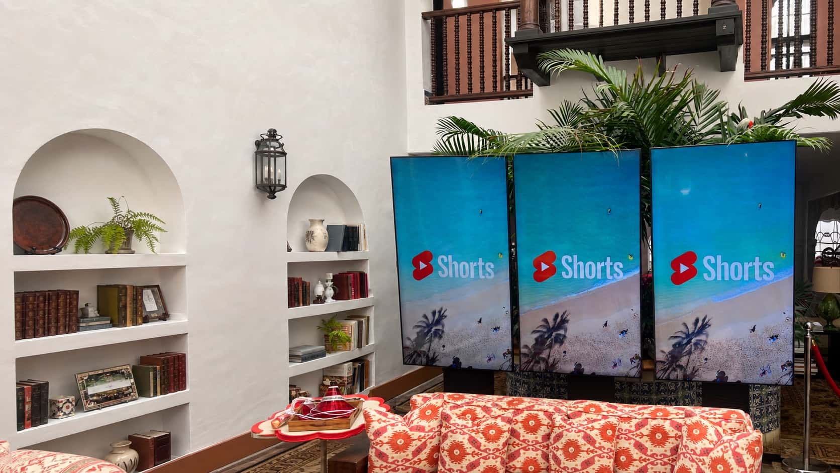 Three portrait displays on professional event stands in an Orlando venue