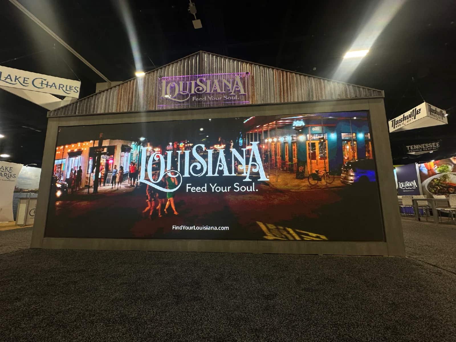 Wide LED video wall built into a Louisiana tourism exhibit at a trade show