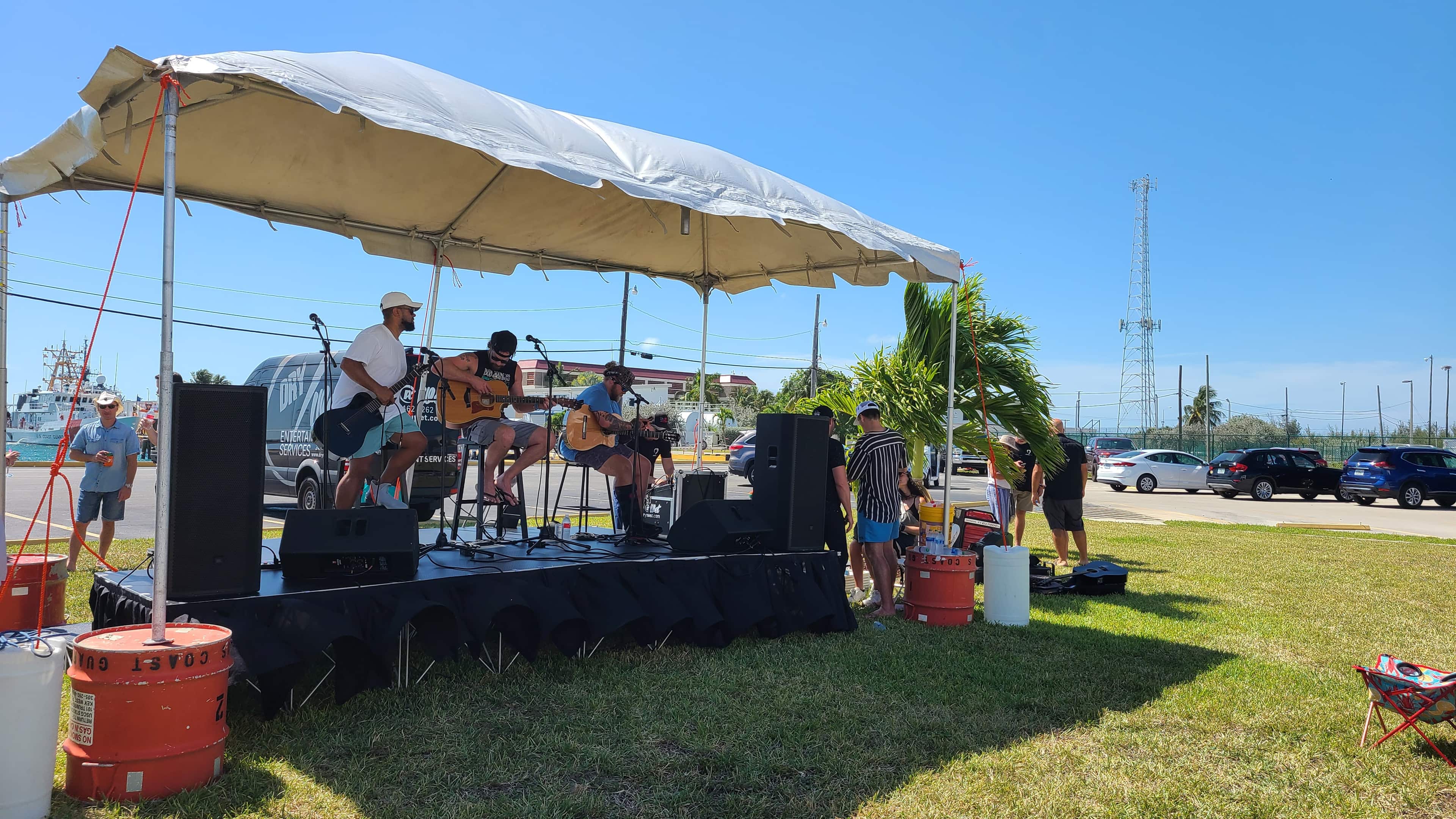 Band performing on a modular outdoor stage in South Florida