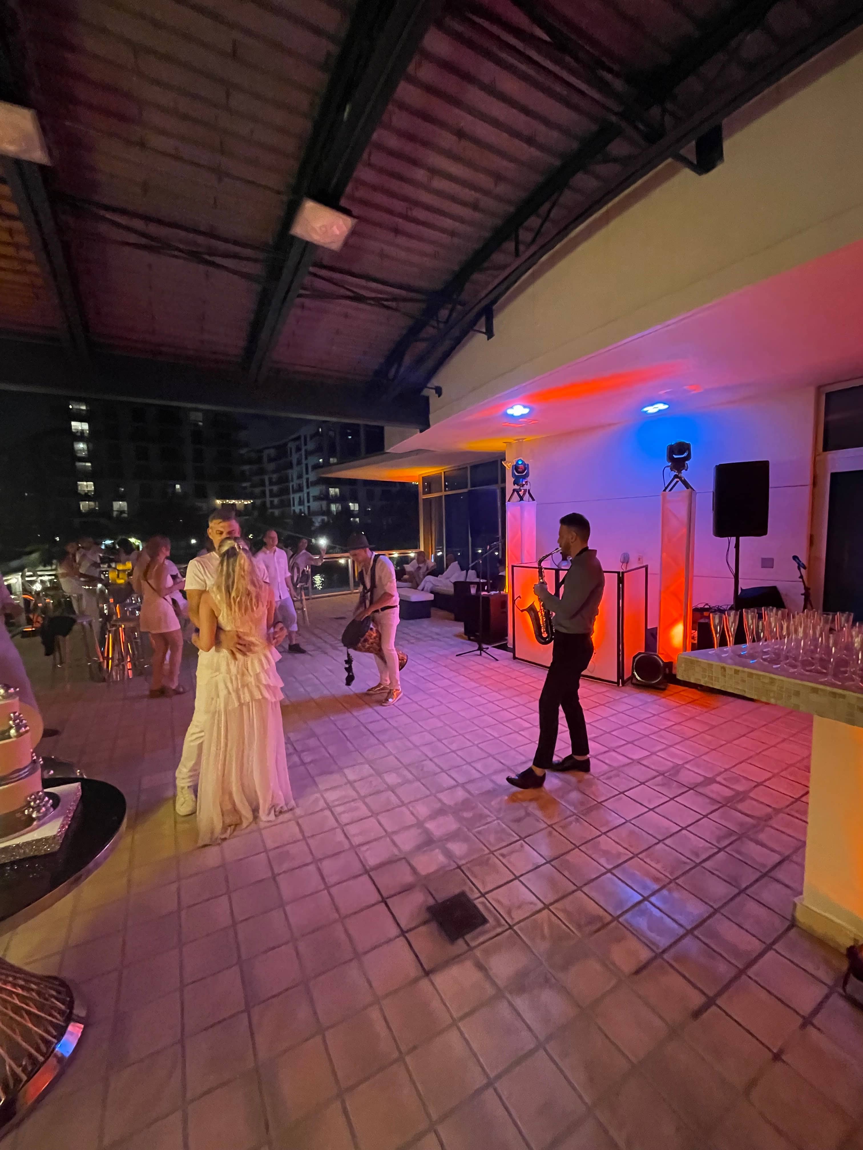 DJ booth, audience speakers, lighting, and live performers at a real Miami event