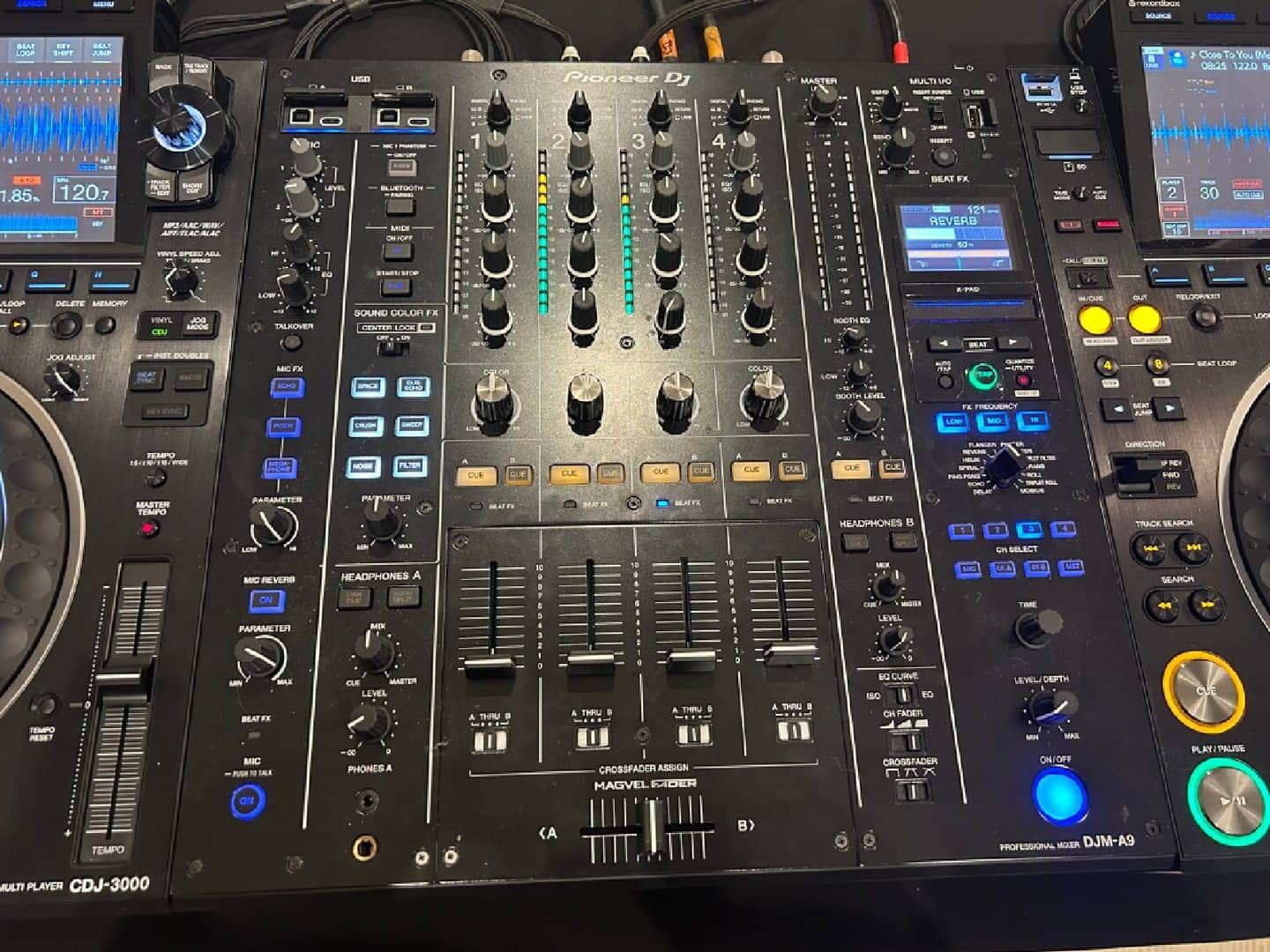 Overhead DJ mixer view showing channels, faders, EQ, and effects controls