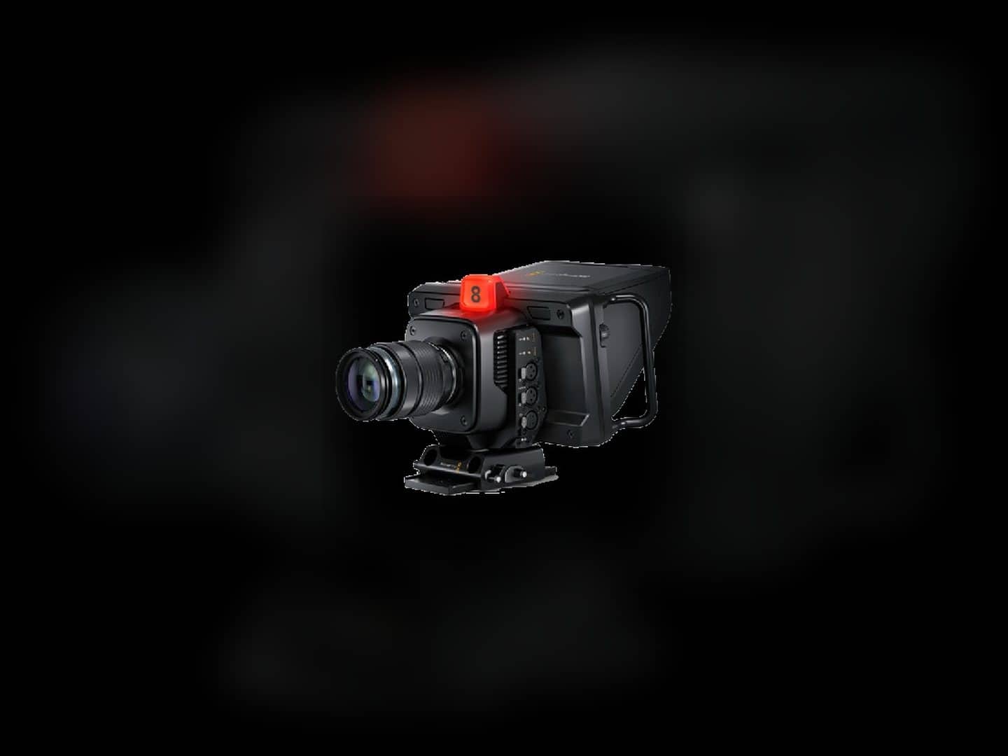 Blackmagic Design studio camera with lens, body, and connections visible