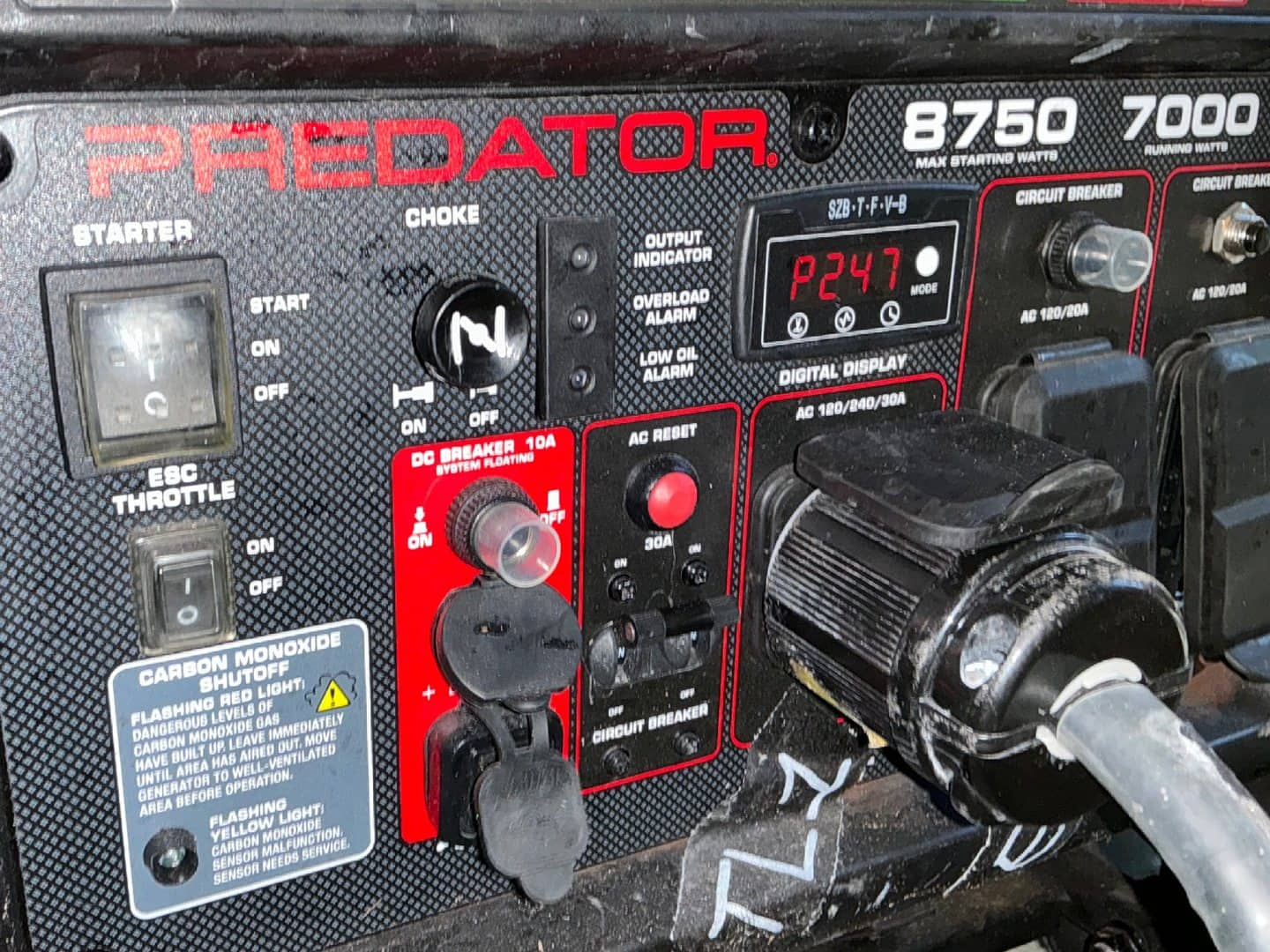 Close view of the generator control panel with a connected production power cable