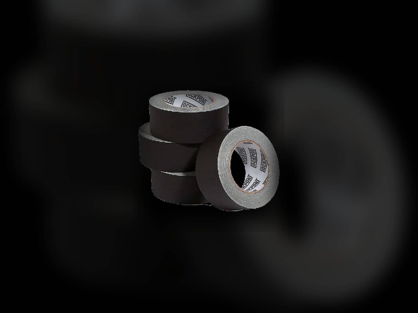 Stack of black gaffer-tape rolls in an isolated product view