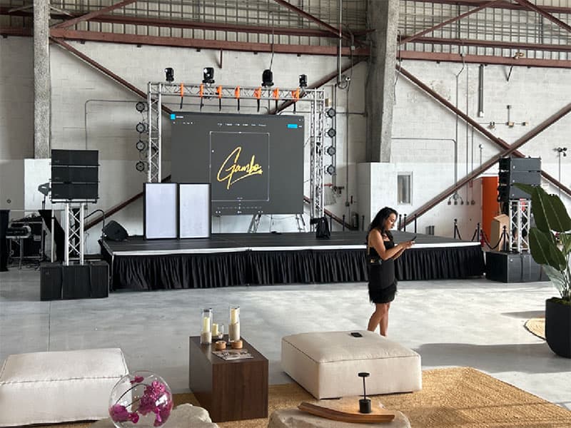 Portable stage illuminated by stage lights