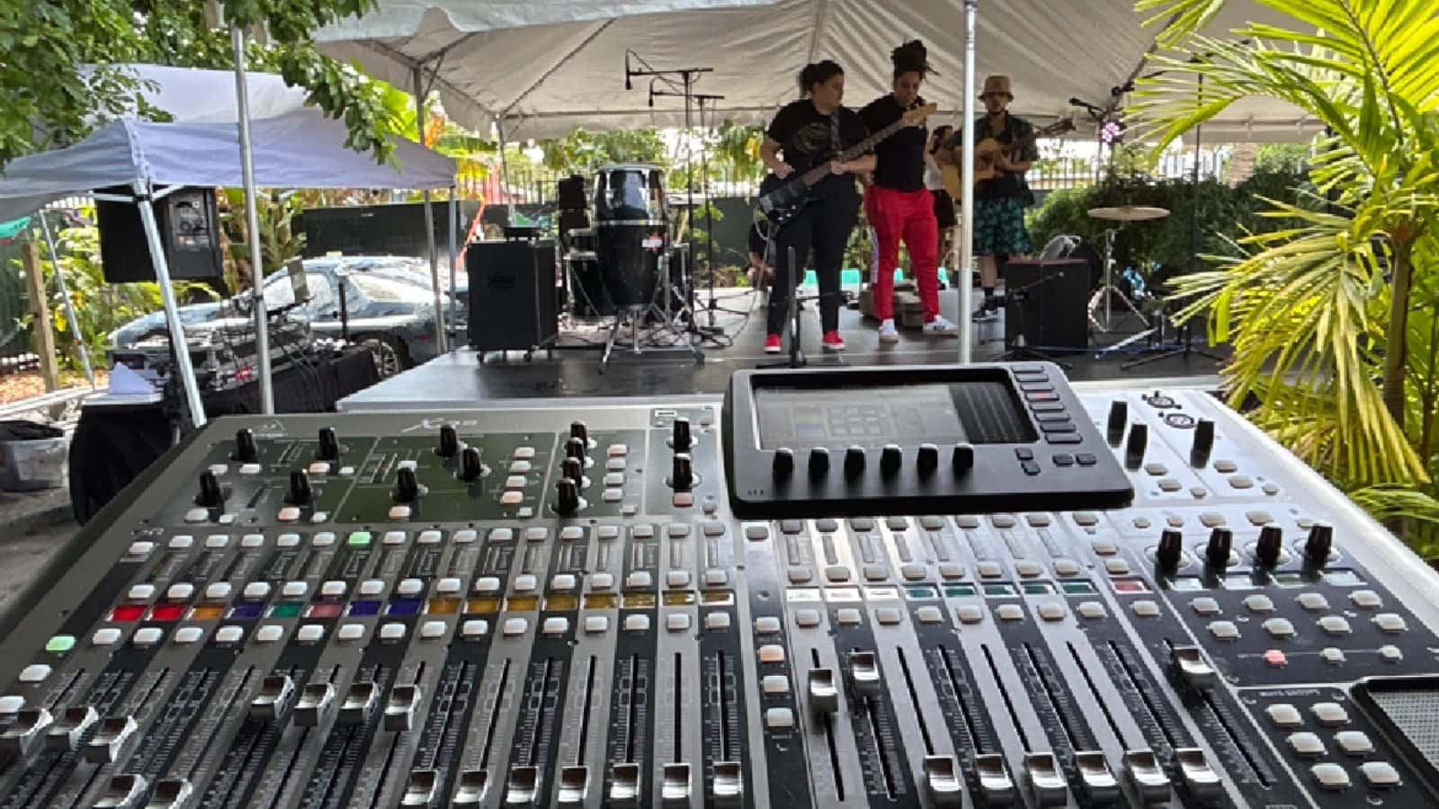 Digital audio mixer controlling a live band performance