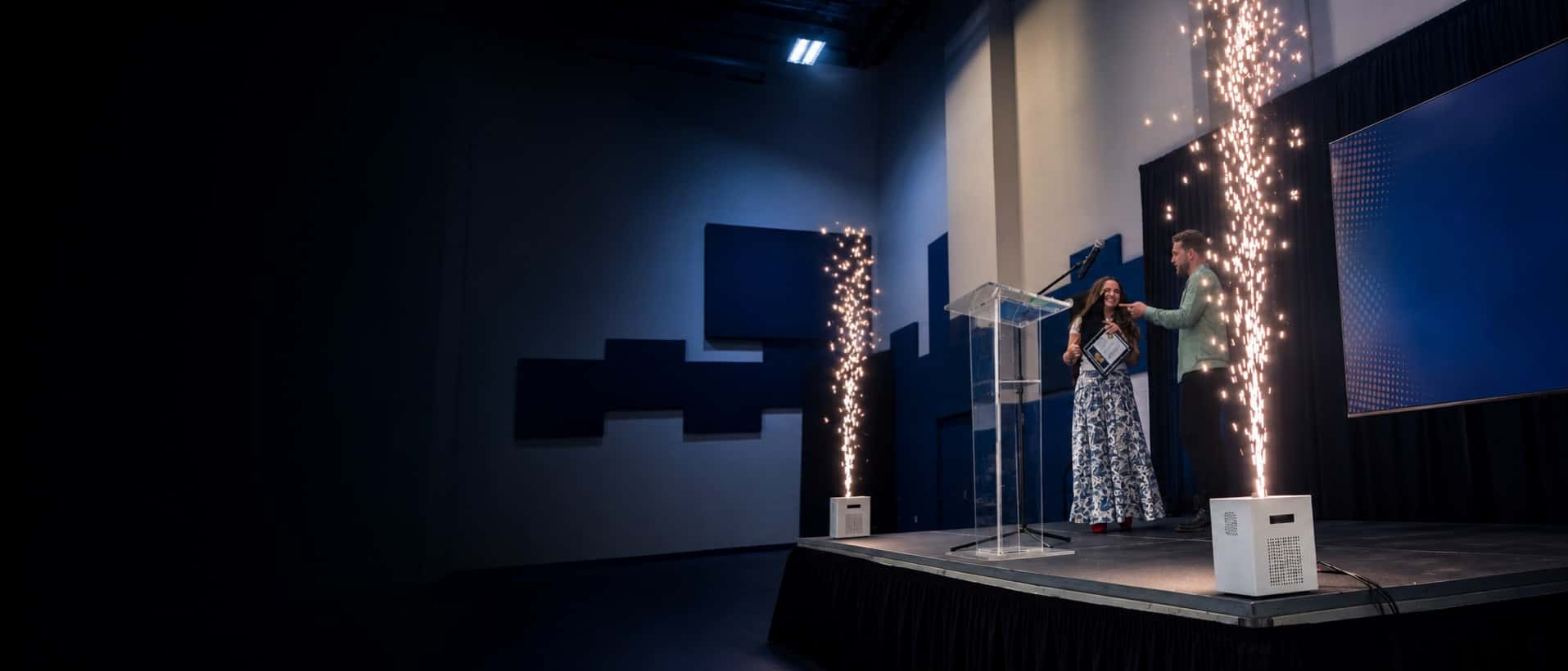 Professional cold spark machine rental effects framing an awards stage in Miami