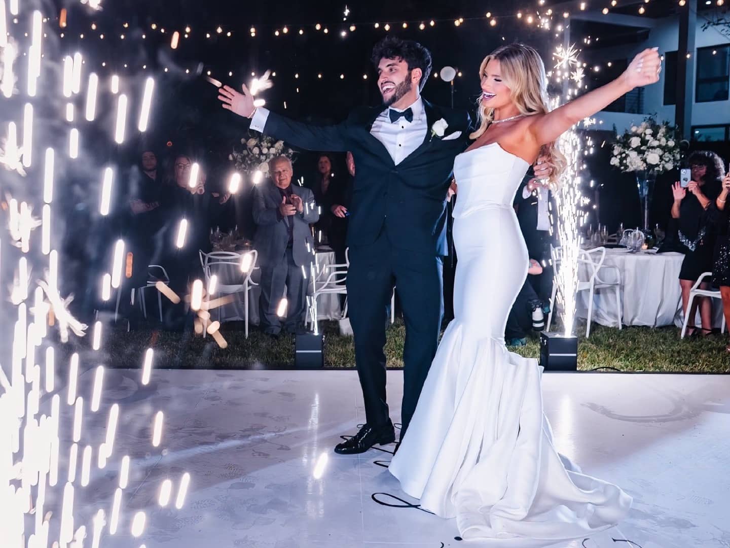 Cold spark machines framing a wedding couple during a Miami event