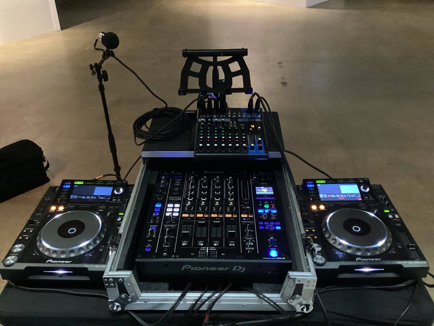 Two Pioneer CDJ players and a DJ mixer arranged in a flight case