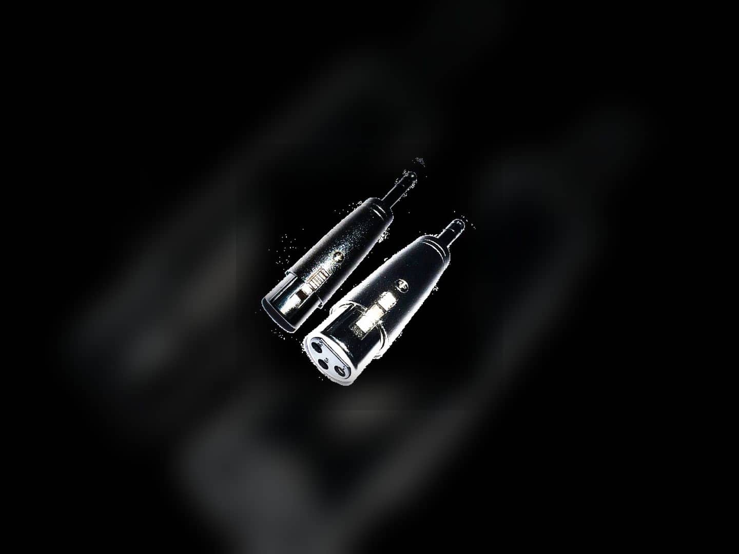 XLR-female-to-quarter-inch audio adapters with both connector types visible