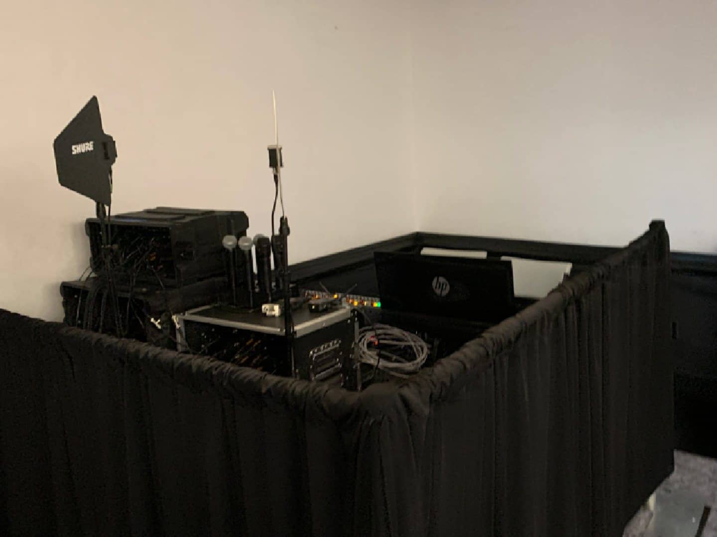 Black tech-surround drape enclosing an event control position