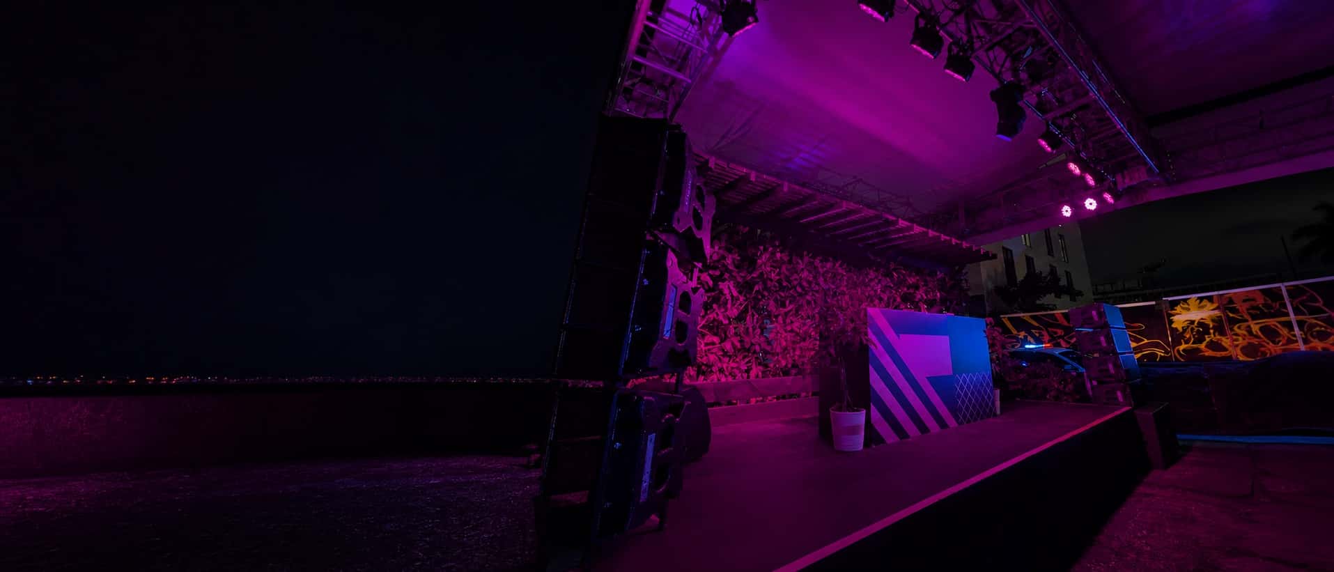 Portable event stage with overhead truss and professional lighting in Miami