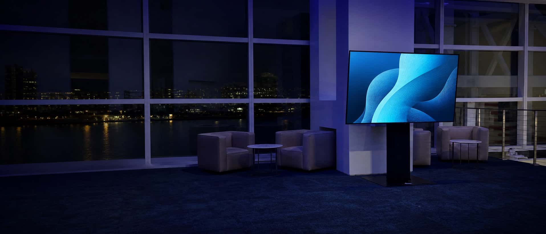 Large flat-screen TV on a professional freestanding event display in Miami